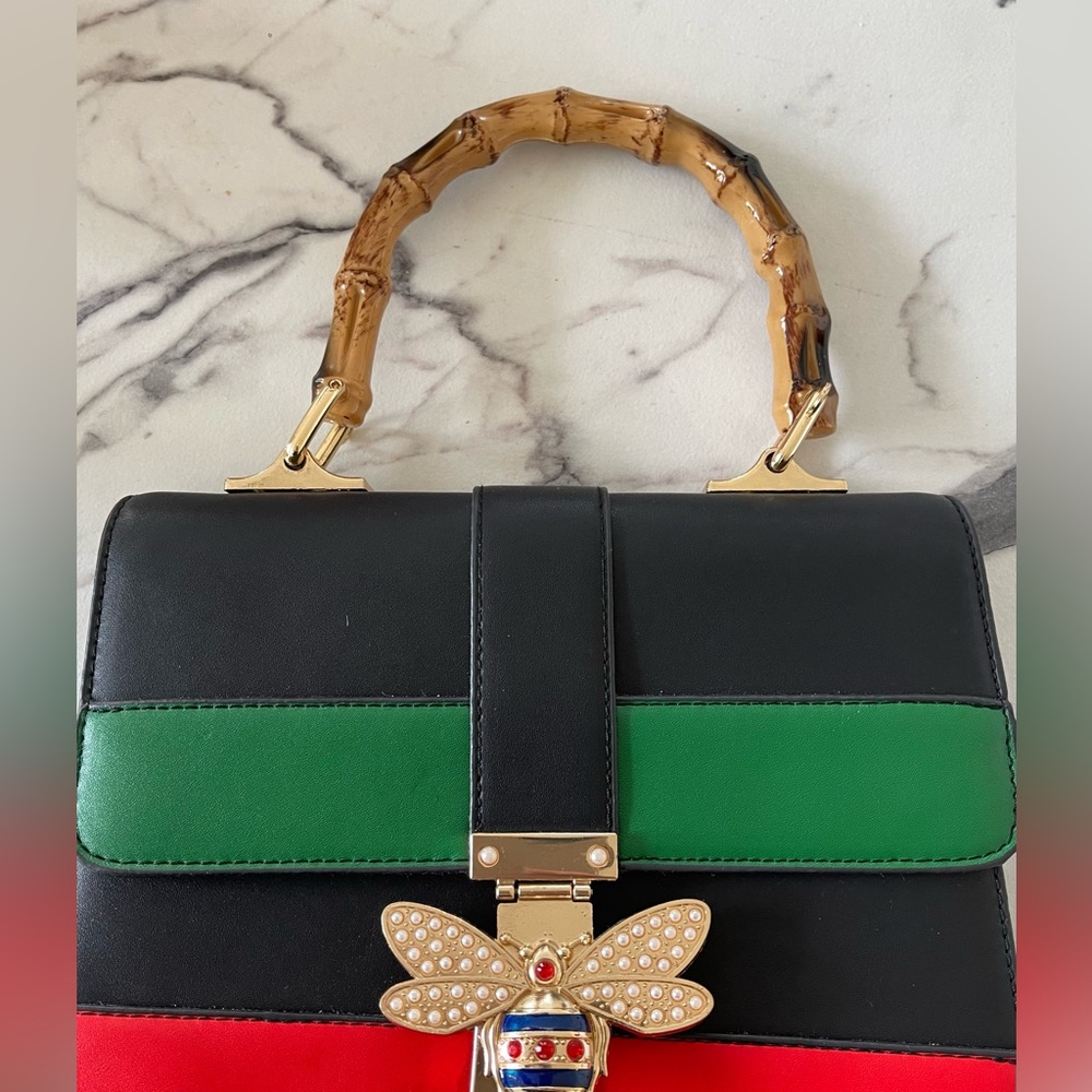 Gently used bee clasp crossbody purse.